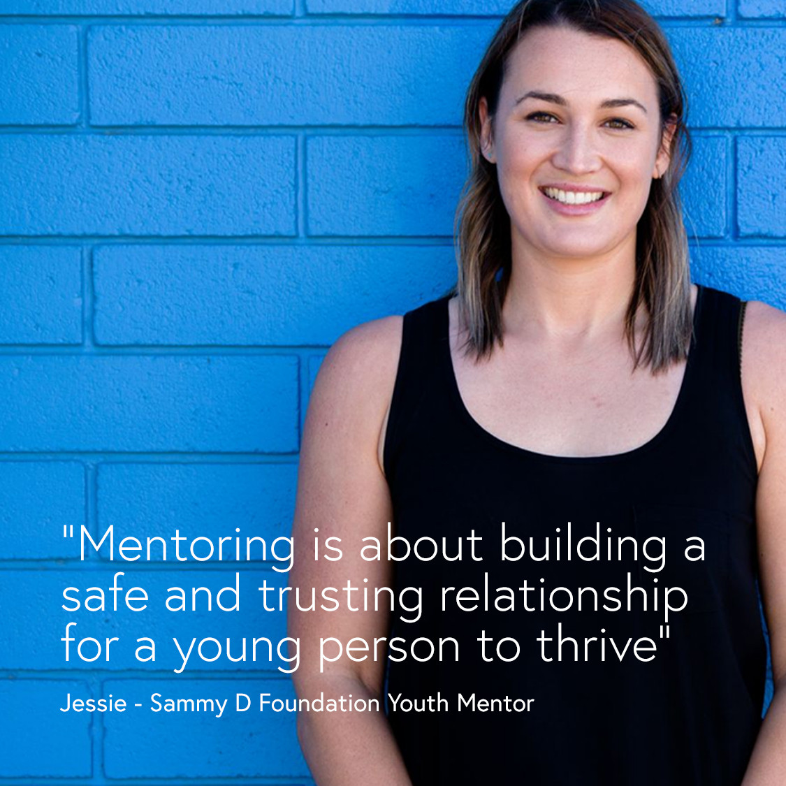 A person standing in front of a brick wall. A quote reads: "Mentoring is about building a safe and trusting relationship for a young person to thrive." The quote is attributed to Jessie, a Youth Mentor at the Sammy D Foundation.