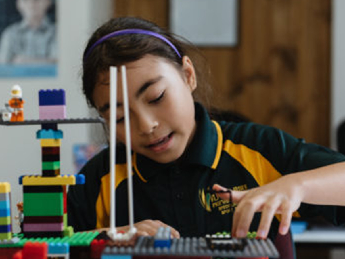 A child playing with lego.